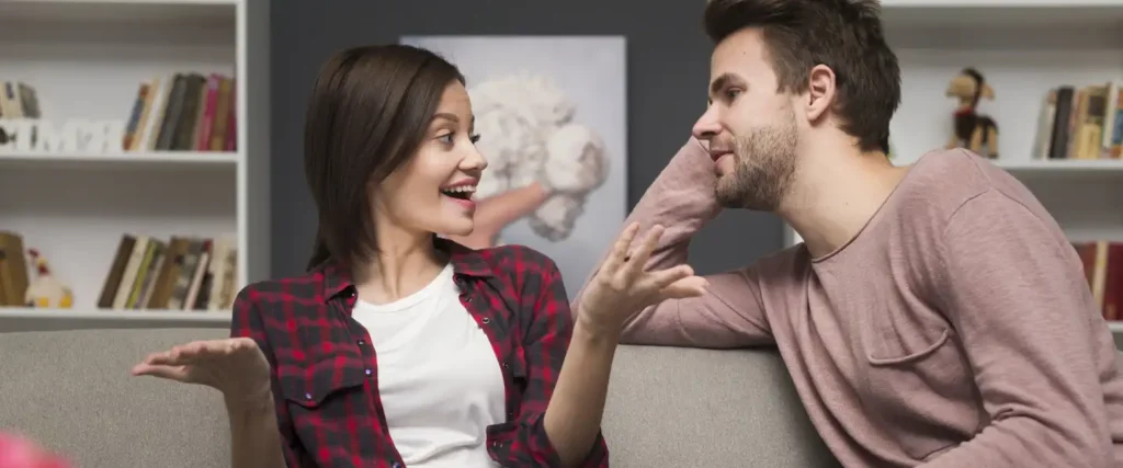 A happy, emotionally connected couple talking and laughing, showing the importance of communication and intimacy.